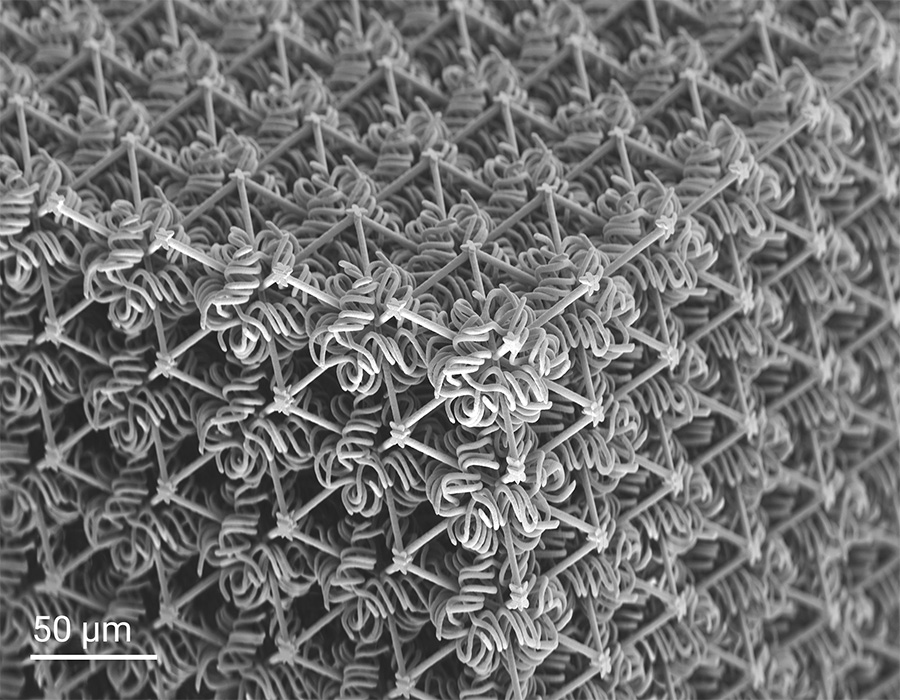 Double-network mechanical metamaterials that achieve a tenfold increase in stiffness and stretchability compared to pure monolithic and woven metamaterials.