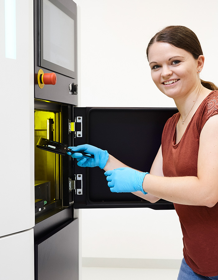 Our colleague starting a print at our Quantum X system