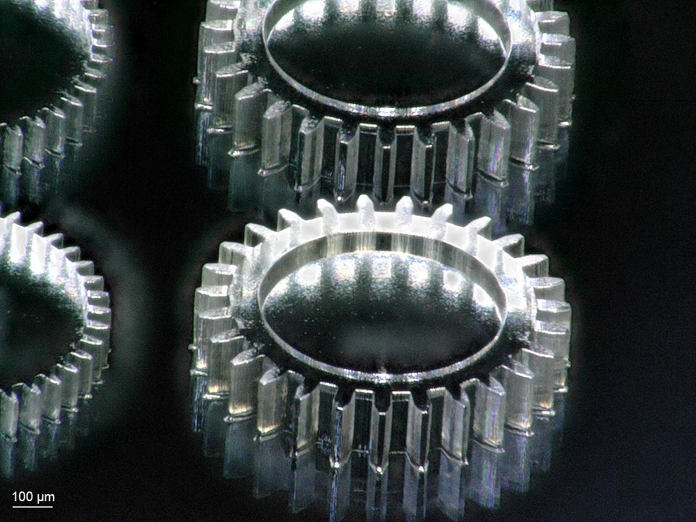 Closeup of 3D-printed gears with a diameter of 1 millimeter