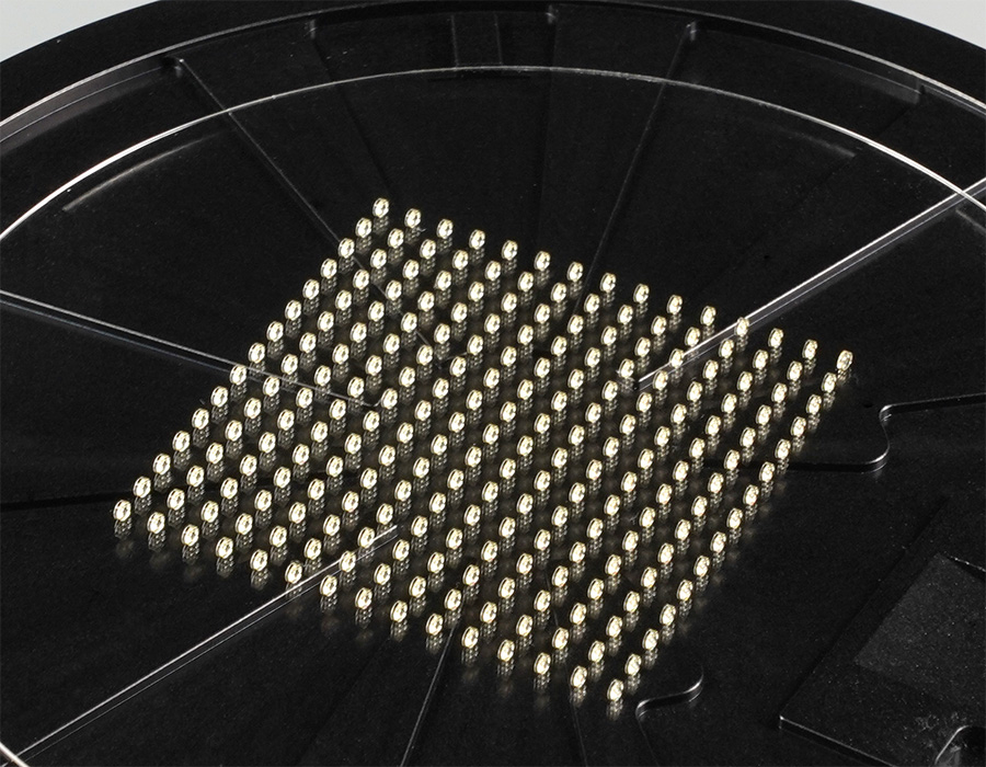 Array of 225 biconvex, aspherical lenses printed vertically on a 4” glass wafer