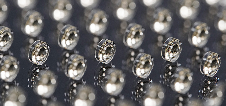 225 highest precision double-sided aspherical lenses, manufactured by wafer-scale 3D printing