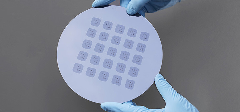 Fully populated 8” master fabricated by step and repeat nanoimprint lithography (NIL) from a 2GL-printed single die master.
