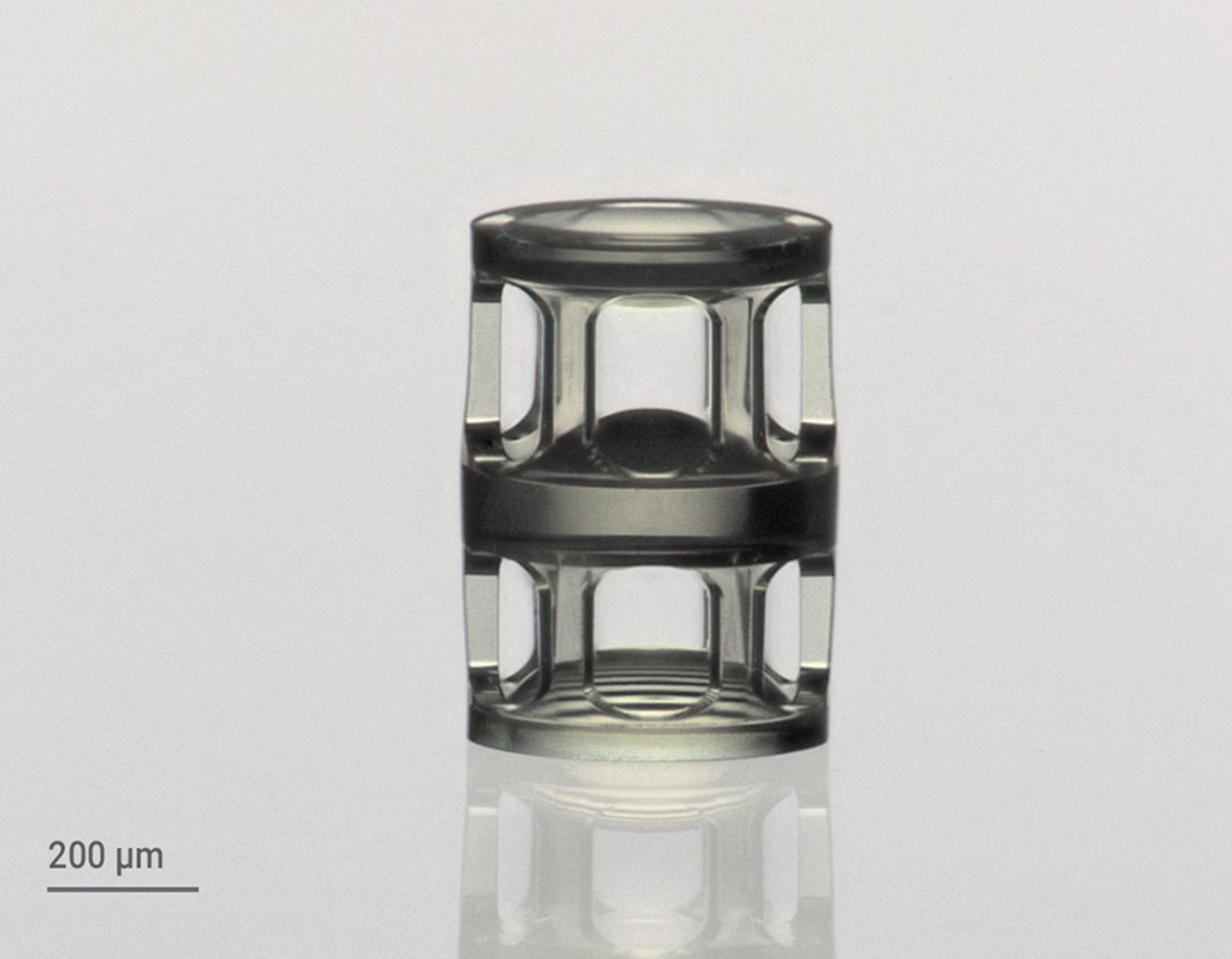Three stacked 3D printed aspherical lenses