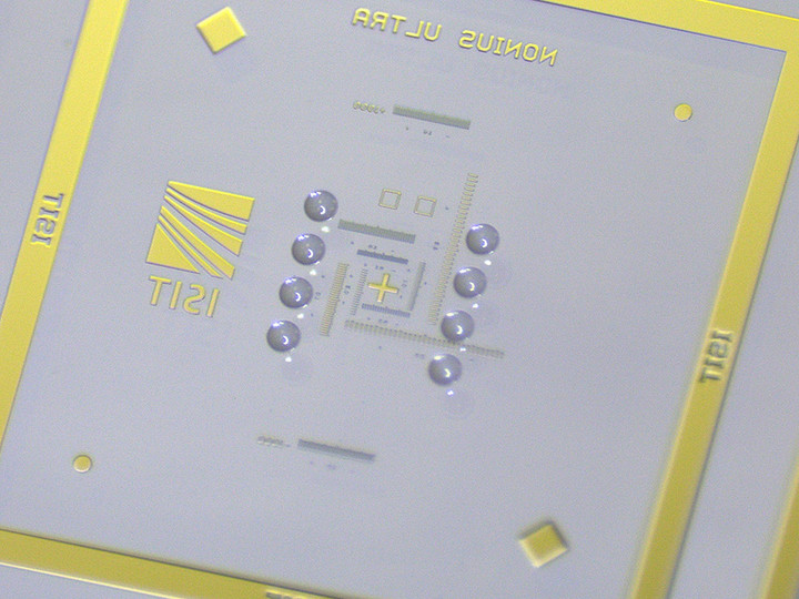 Close-up of 8 microlenses per chip on an 8-inch wafer