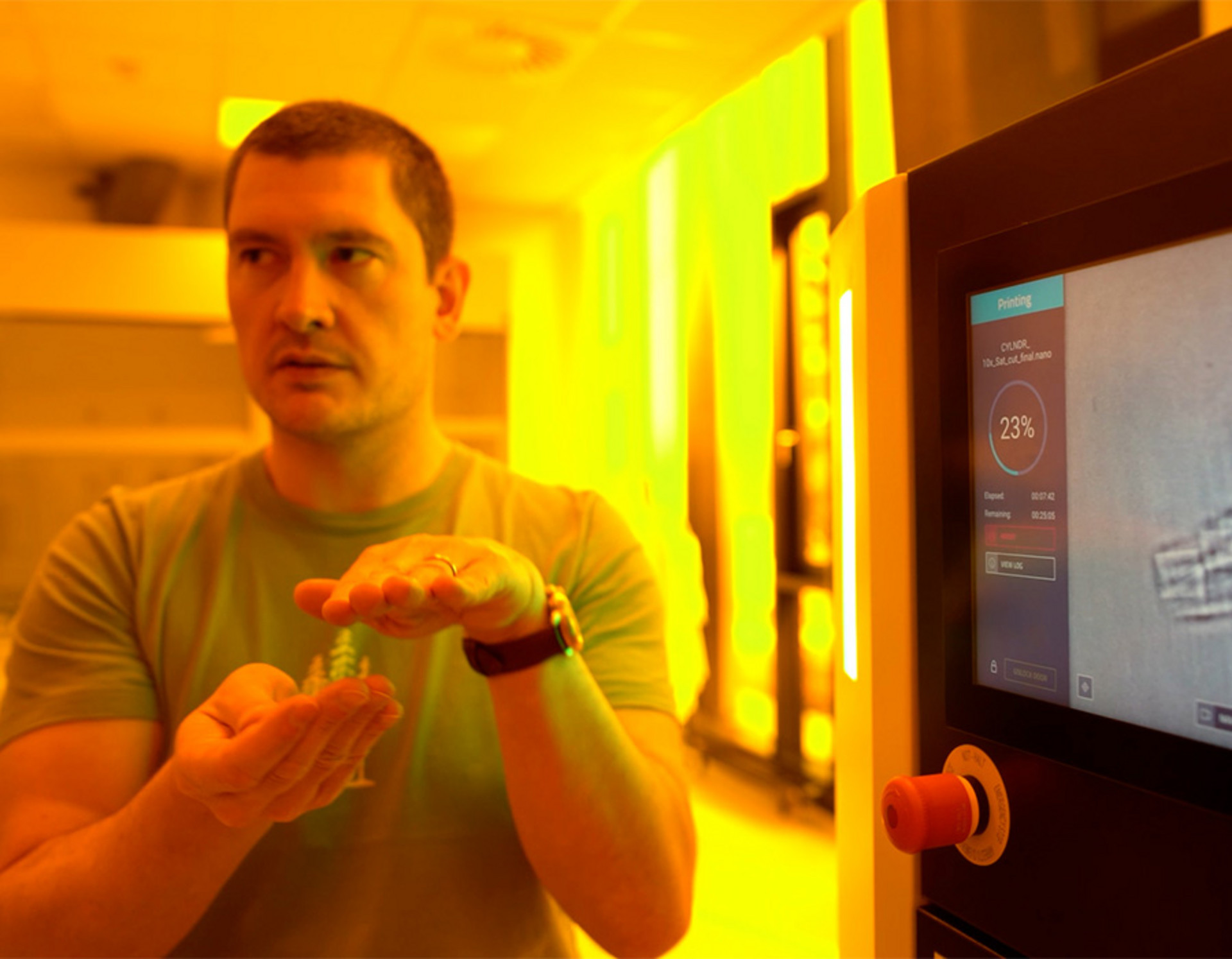 A person standing in front of the touchscreen of a Quantum X system 