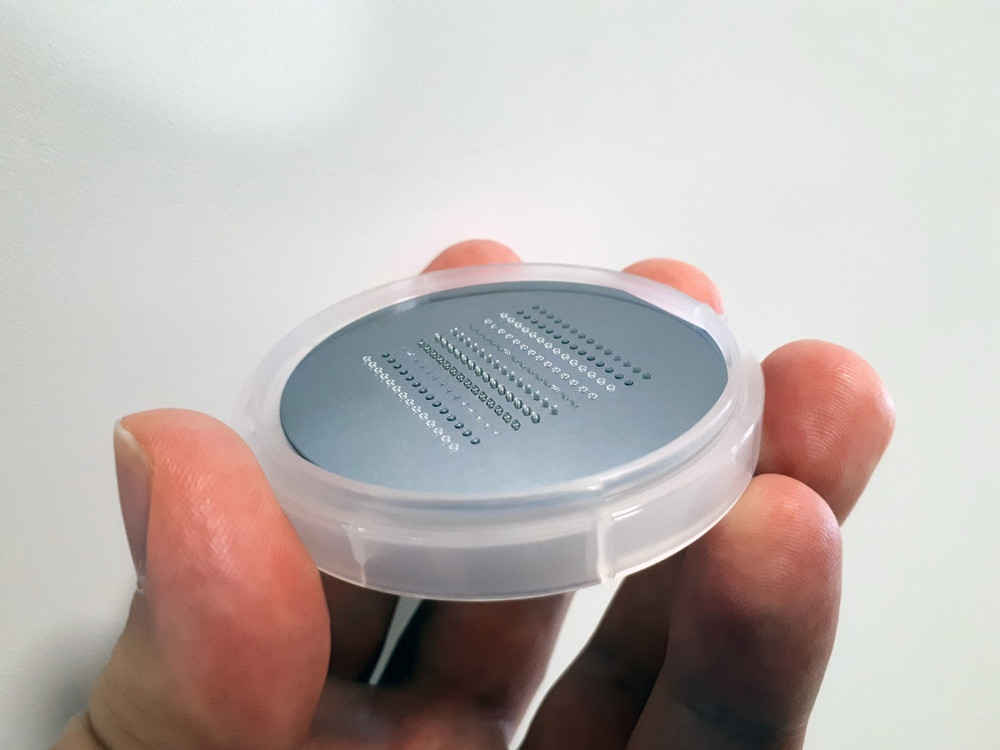 3D-printed millimeter-sized parts on a 2-inch wafer substrate