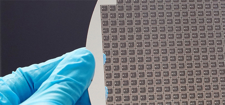 An 8-inch wafer hold by a person