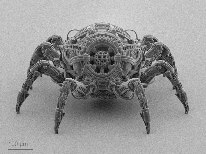 Microscale spider-like structure featuring intricate lattice details and robotic-inspired geometry.