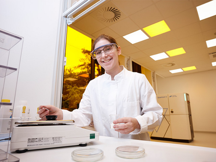 young woman working with chemical materials