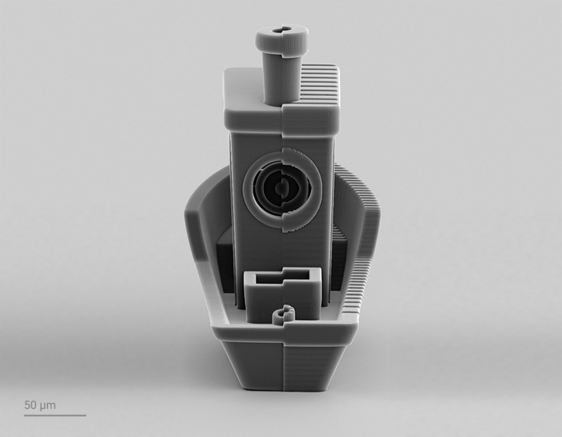 3D printed Benchy boat split into two parts. Left part: 3D printed by 2GL. Right part: 3D printed with conventional 2PP. 