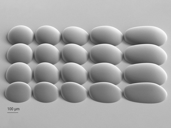 Animated GIF of a SEM image of a freeform microlens array and a mold tool generated from the array by electroforming