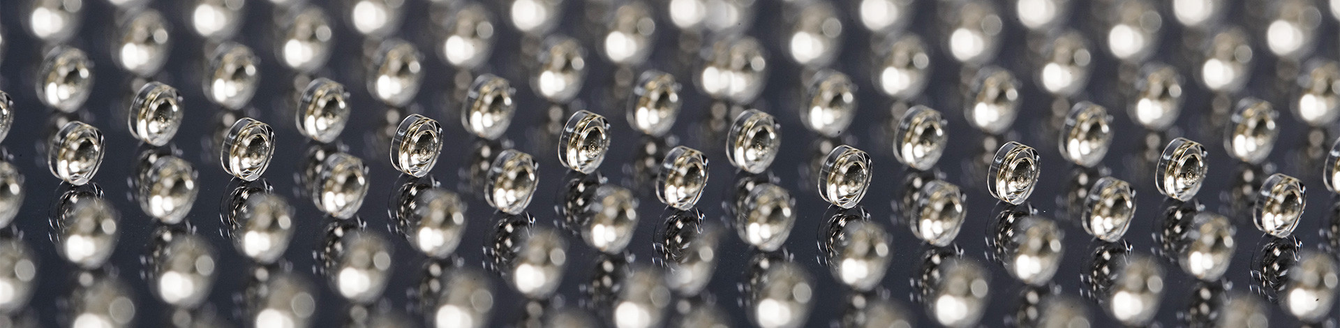 225 highest precision double-sided aspherical lenses, manufactured by wafer-scale 3D printing